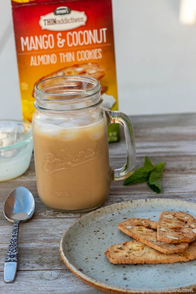 Iced Coffe in a mug, cookies on a plate