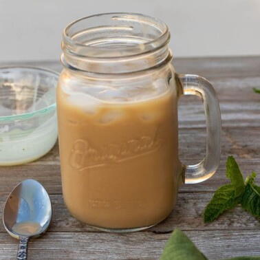 creamy iced coffee in a mason jar