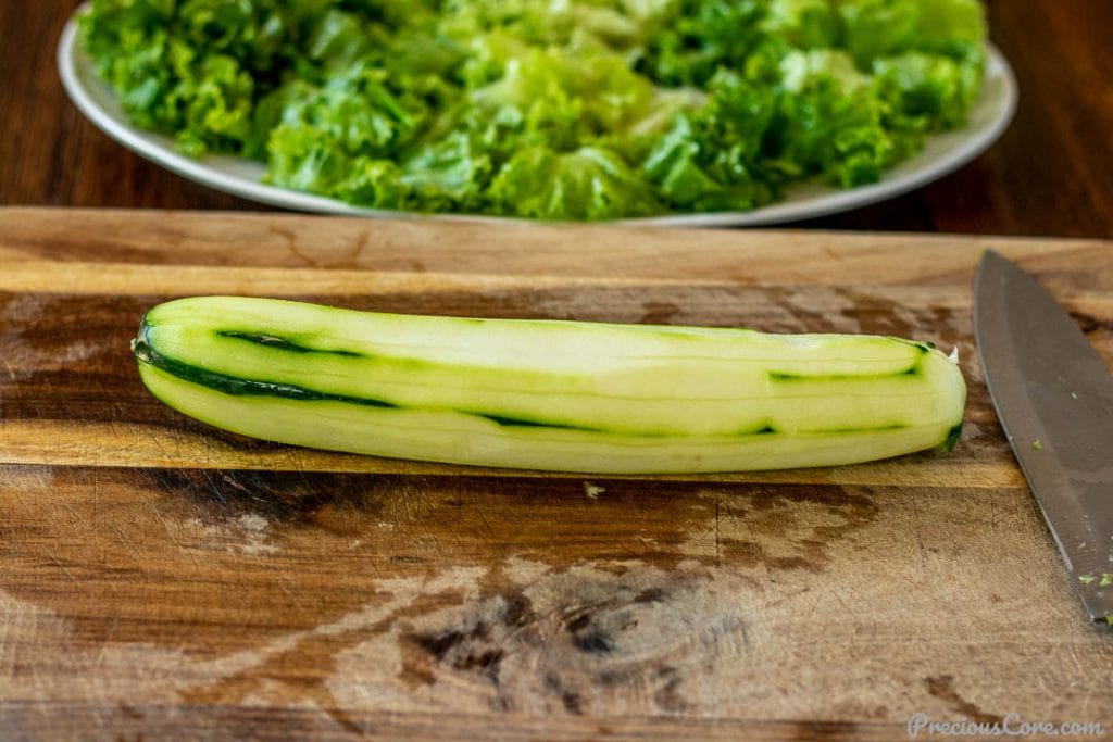 Peeled garden cucumber on a chopping board