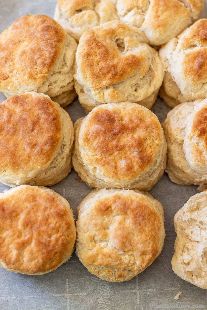 Freshly baked 3 ingredient biscuits on a baking sheet