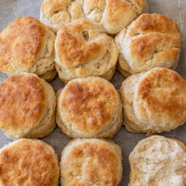 baked biscuits on parchment paper on a baking sheet