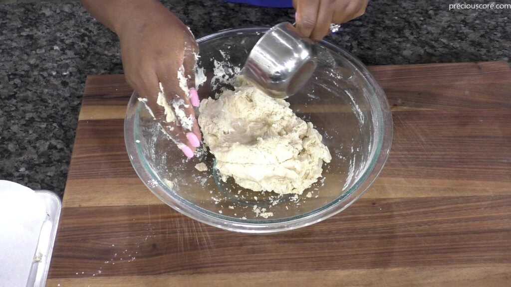 Hand pouring Sprite into bowl. 