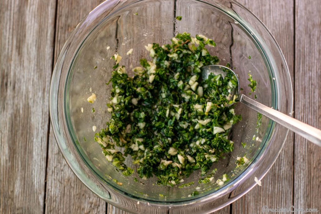 Green marinade for fish in a mixing bowl