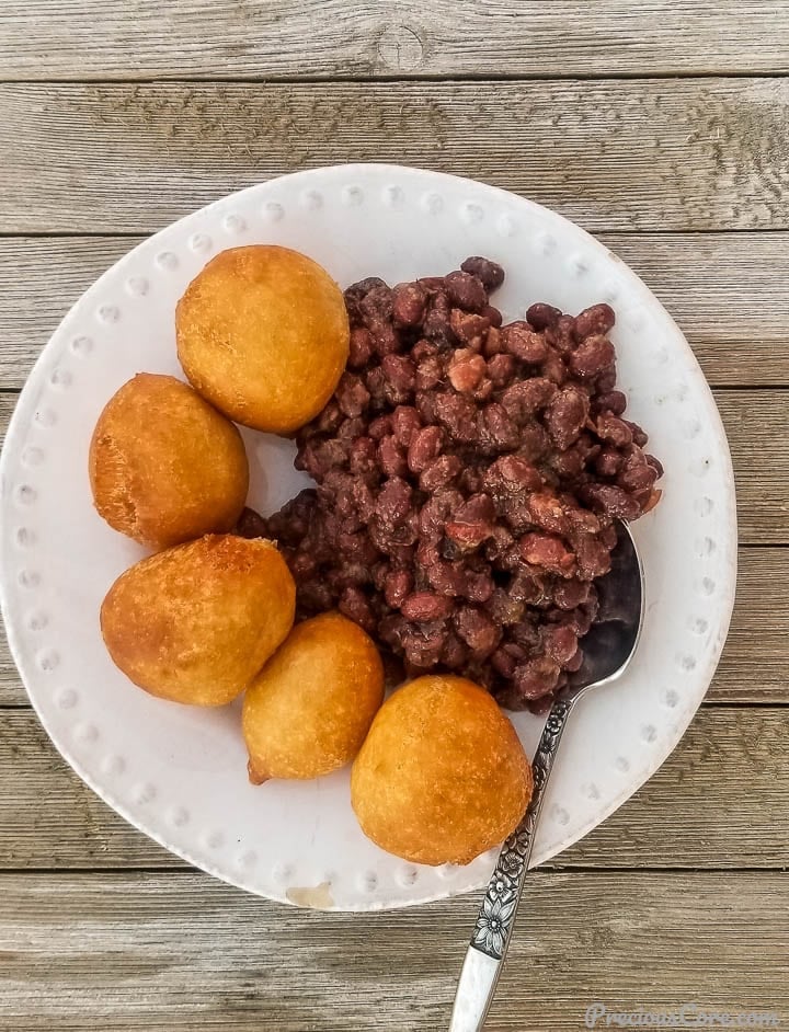 Puff puff and beans on a plate