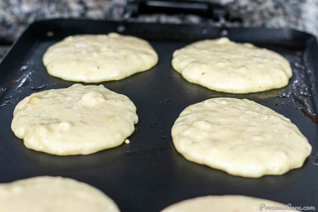 Banana Pancake Batter Cooking on Griddle