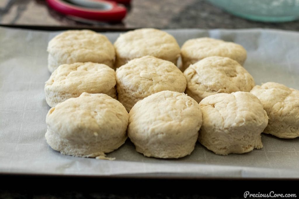 raw biscuit dough on baking sheet