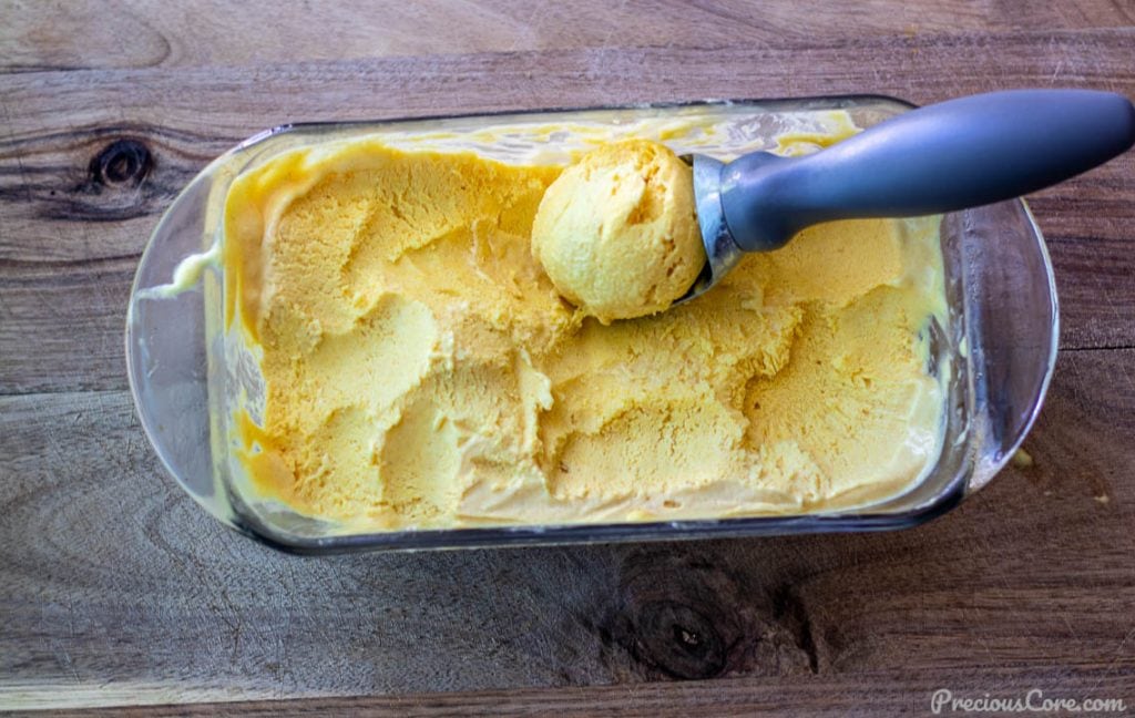 homemade mango no-churn ice cream in a loaf pan