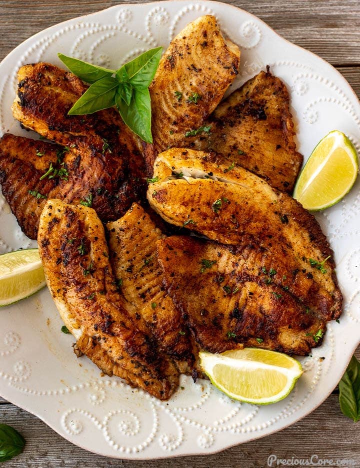 Pan Seared Tilapia on a plate with lime wedges