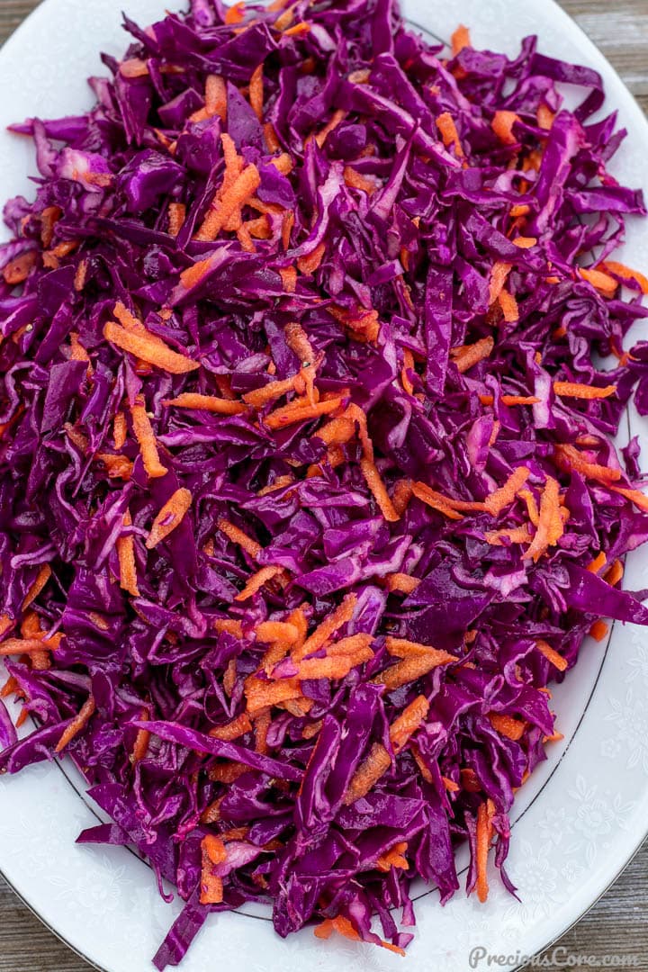 Close shot of purple cabbage slaw with carrots
