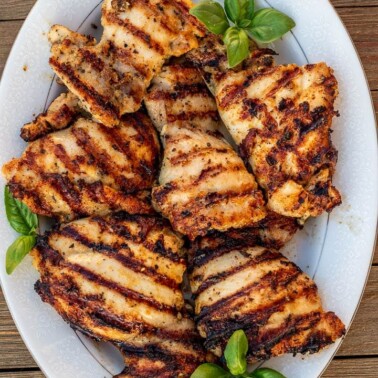 grilled boneless chicken thighs on a platter