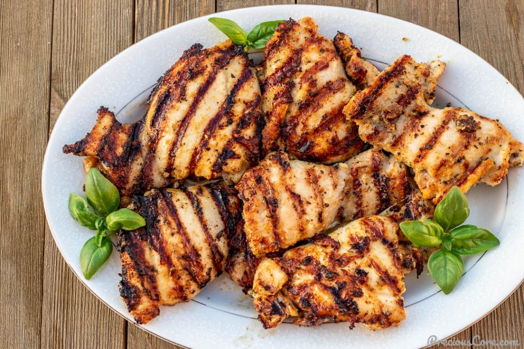 platter of grilled chicken thighs with grill marks