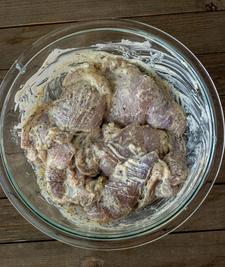 Chicken thighs marinating in yogurt