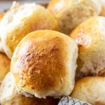 close up of a dinner roll in a basket