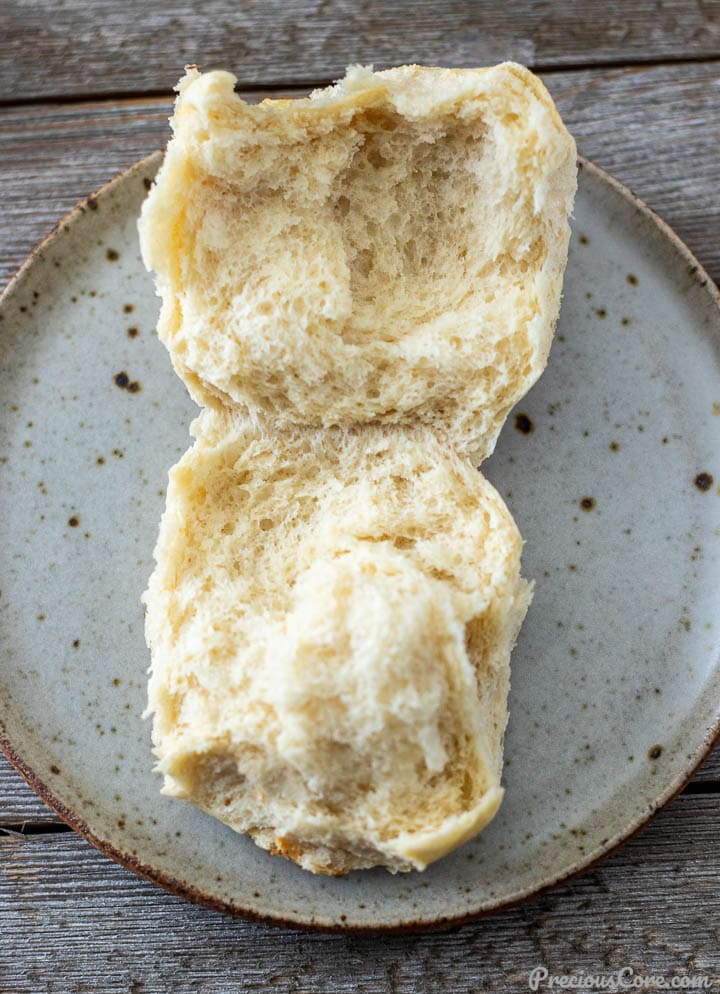 Photo showing opened dinner roll to show fluffiness