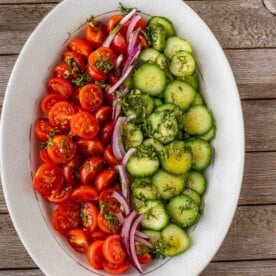 tomato cucumber salad on a platter
