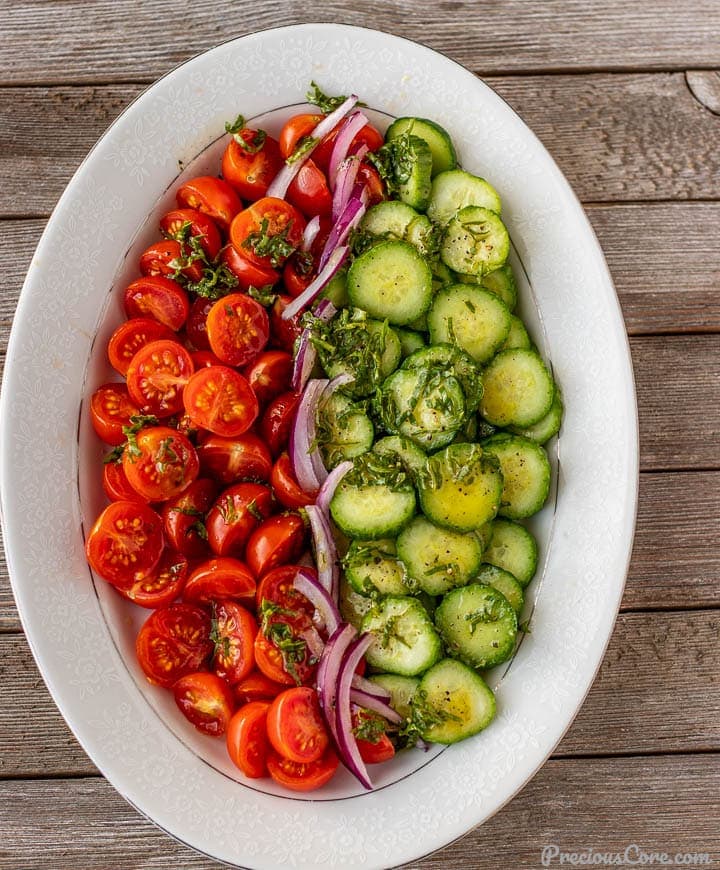 tomato cucumber salad on a platter