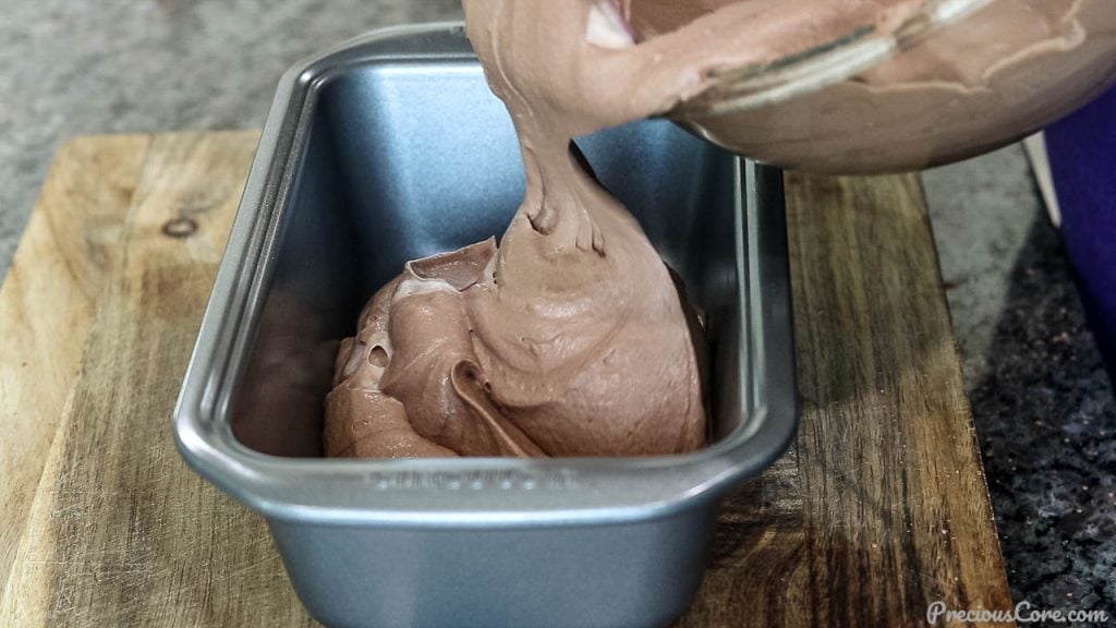 Pouring chocolate ice cream mixture into loaf pan