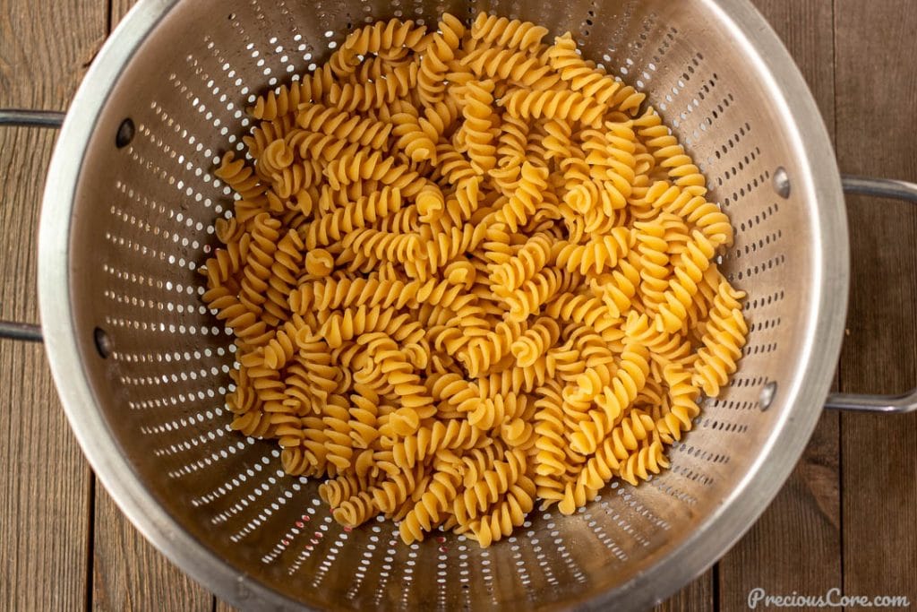 Cooked chickpea pasta in colander