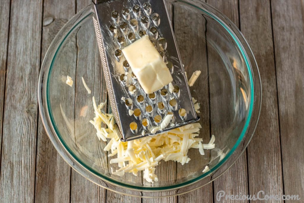 Grated butter in mixing bowl