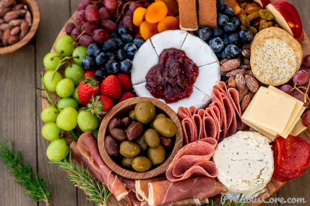 charcuterie board with sweet and salty ingredients