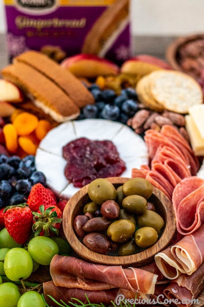 Close up shot of charcuterie board with olives, meats and cheese