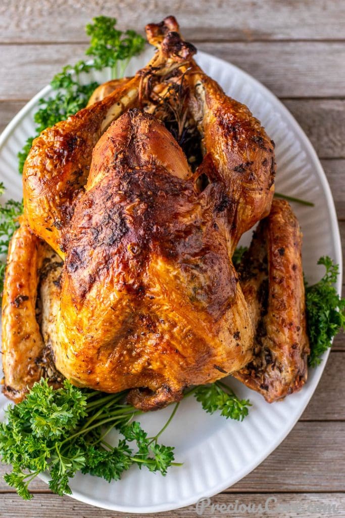 Whole herb roasted turkey on a platter