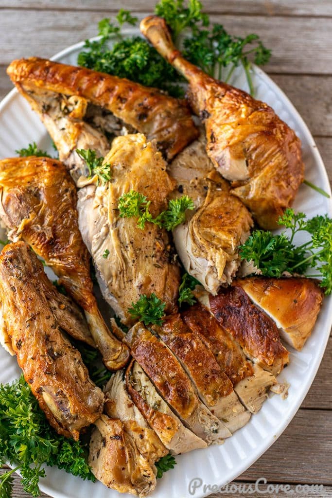 A platter of carved herb roasted turkey