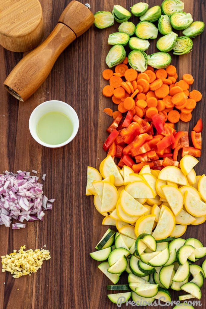 ingredients for sautéed vegetables on cutting board