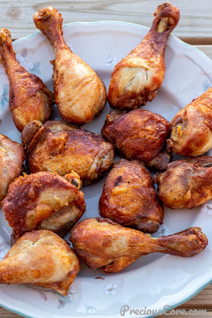 cooked chicken for jollof rice on a serving platter