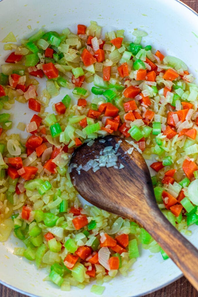 Pot with sauteed onions, garlic, carrots and celery