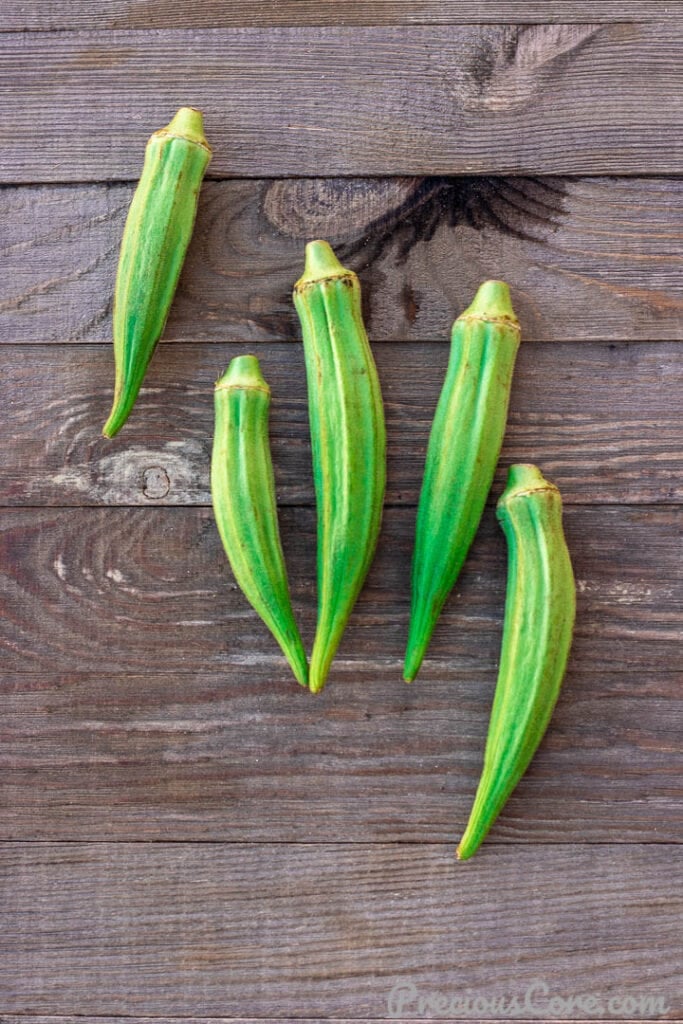 Fresh Okra on wooden board