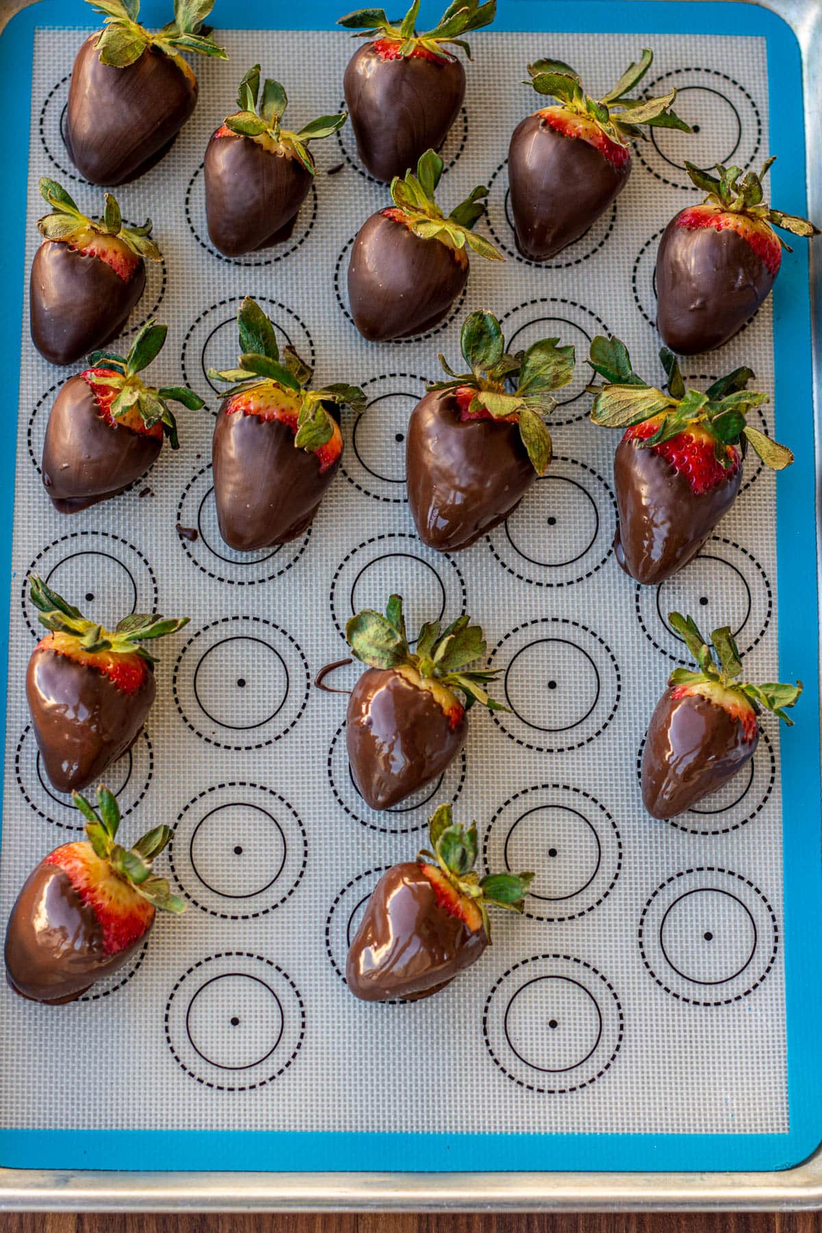 chocolate covered strawberries on a silicon mat