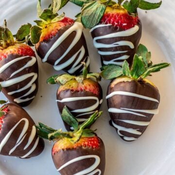 Chocolate dipped strawberries on a plate