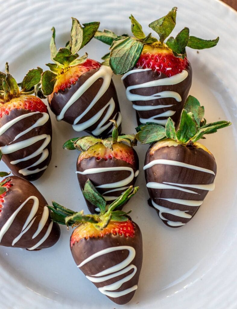 Chocolate dipped strawberries on a plate