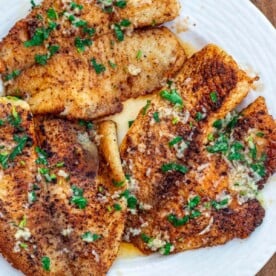 Lemon butter tilapia fillets on a plate