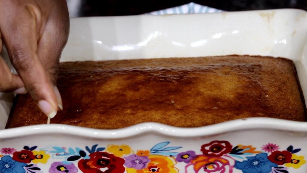 Baked Malva Pudding in baking dish.