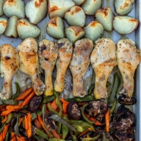 Roasted chicken, potatoes and veggies on a sheet pan