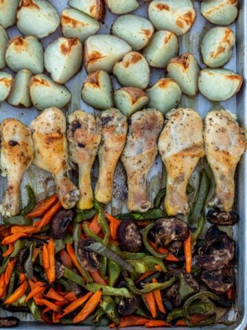Roasted chicken, potatoes and veggies on a sheet pan