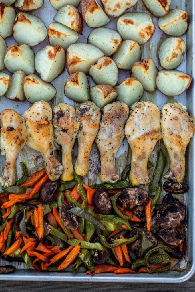 Roasted chicken, potatoes and veggies on a sheet pan
