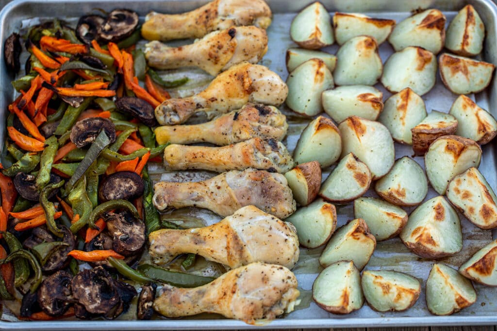 landscape photo of baked chicken potatoes and veggies