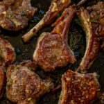 Pan seared lamb chops in a cast iron skillet