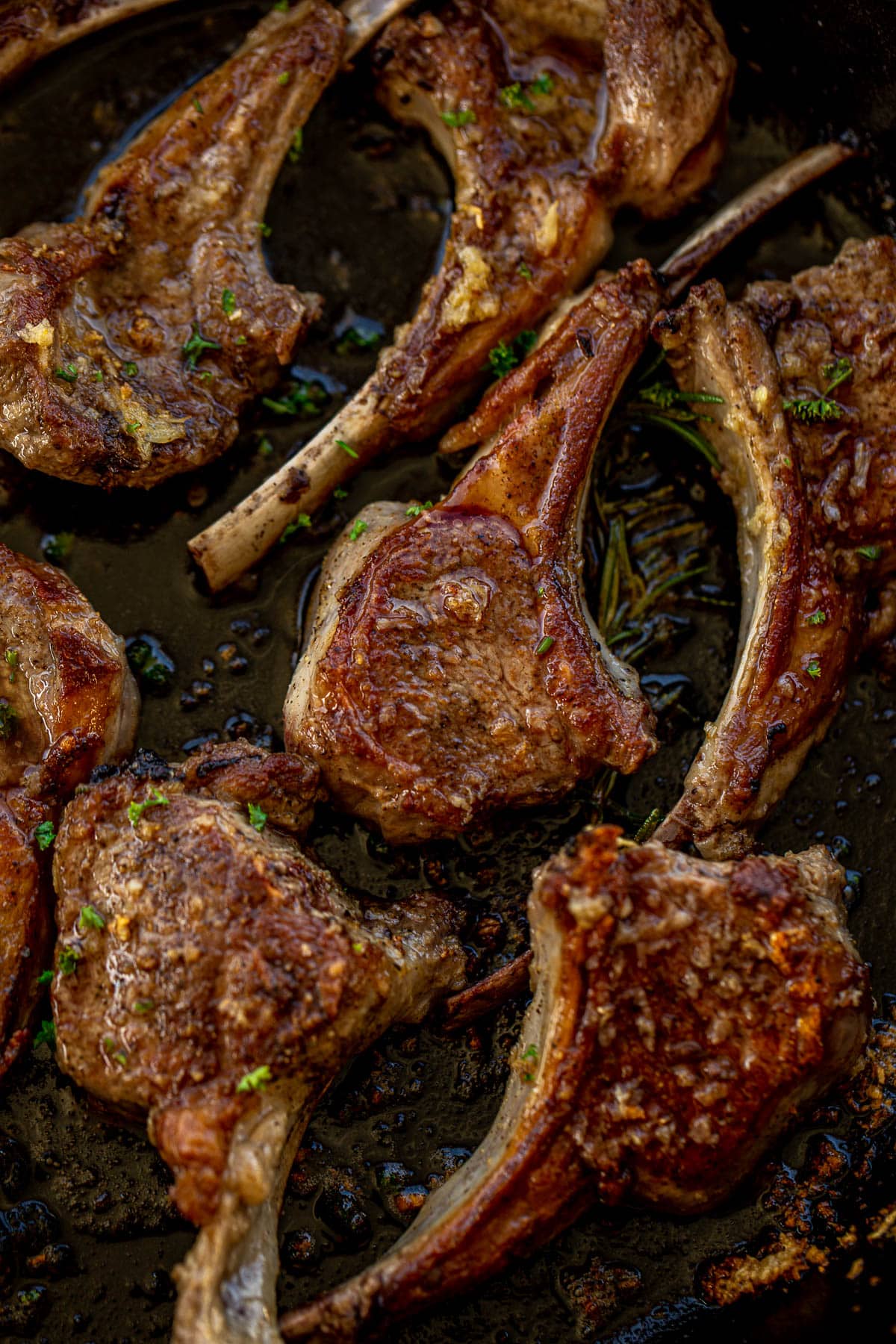 Pan seared lamb chops in a cast iron skillet