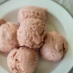 Soops of no churn strawberry ice cream on a plate