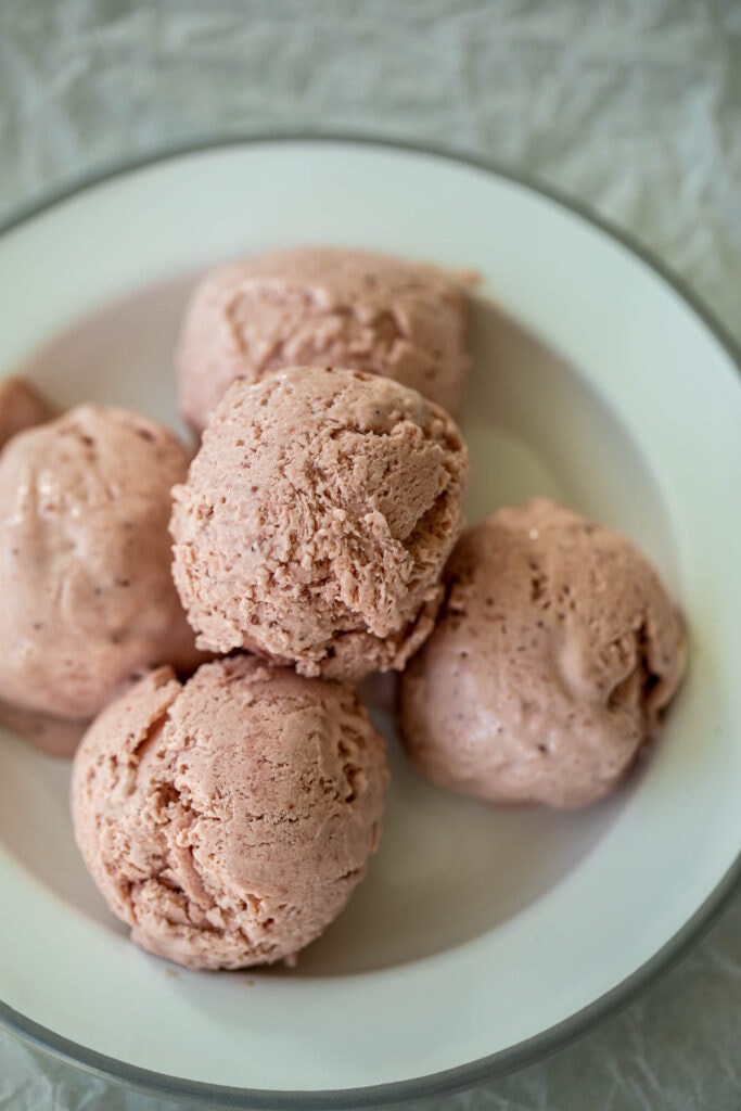 Soops of no churn strawberry ice cream on a plate