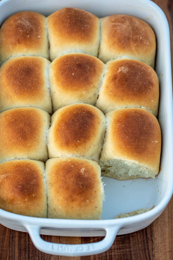 Bread rolls in a pan with one missing