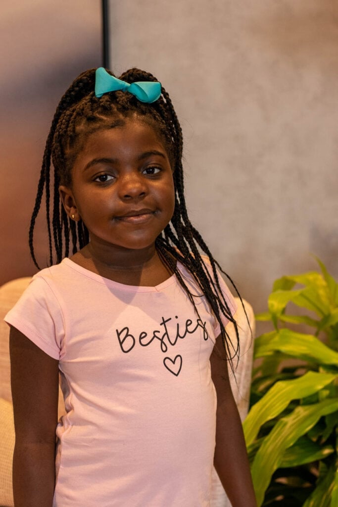 My daughter in a pink t-shirt.