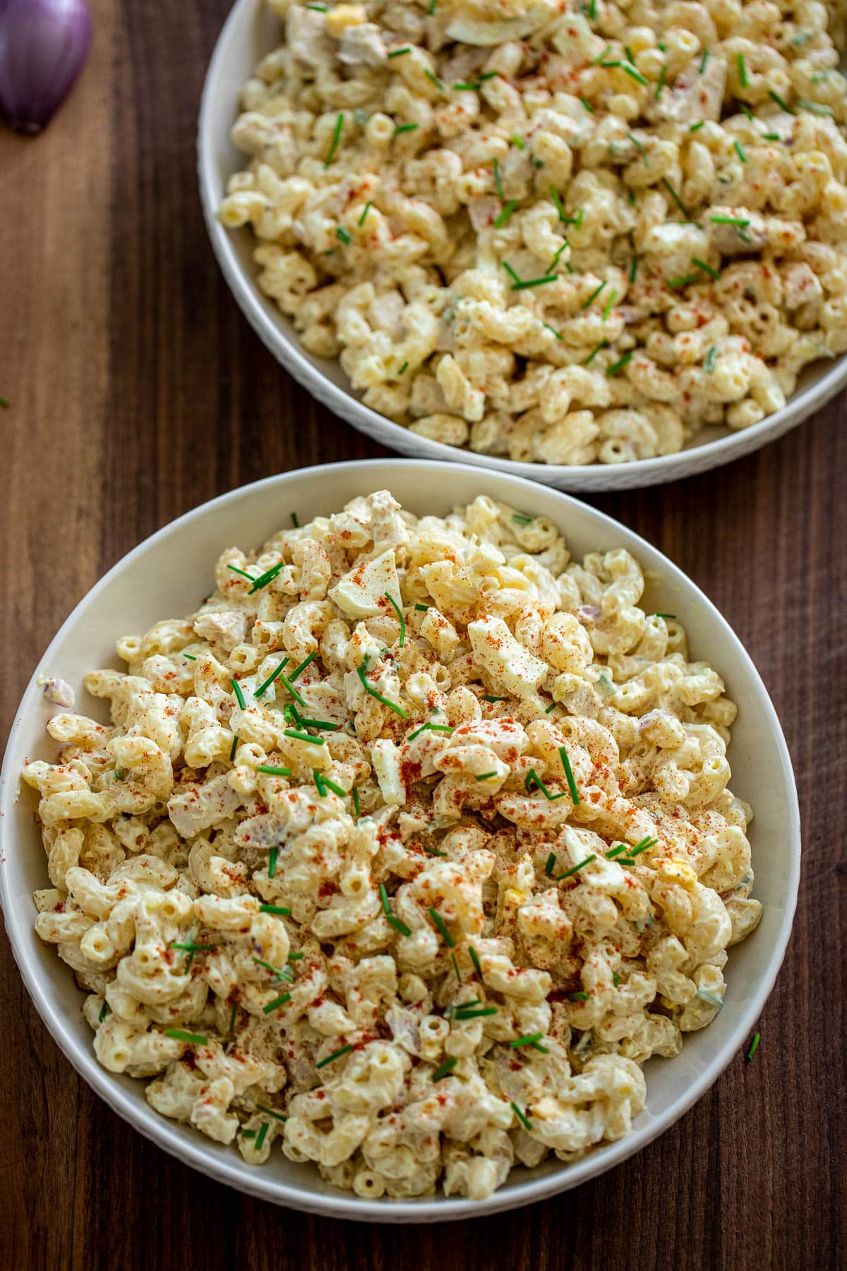 Two large bowls of chicken macaroni salad