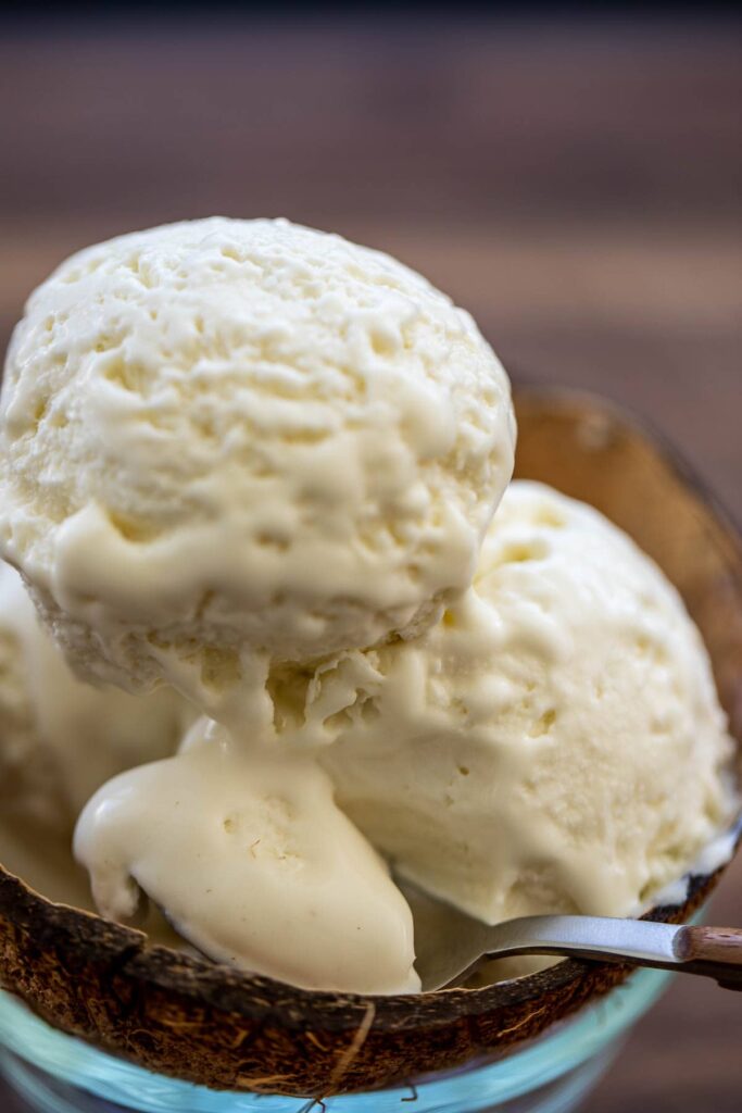 Scoops of ice cream in a bowl made from a coconut shell