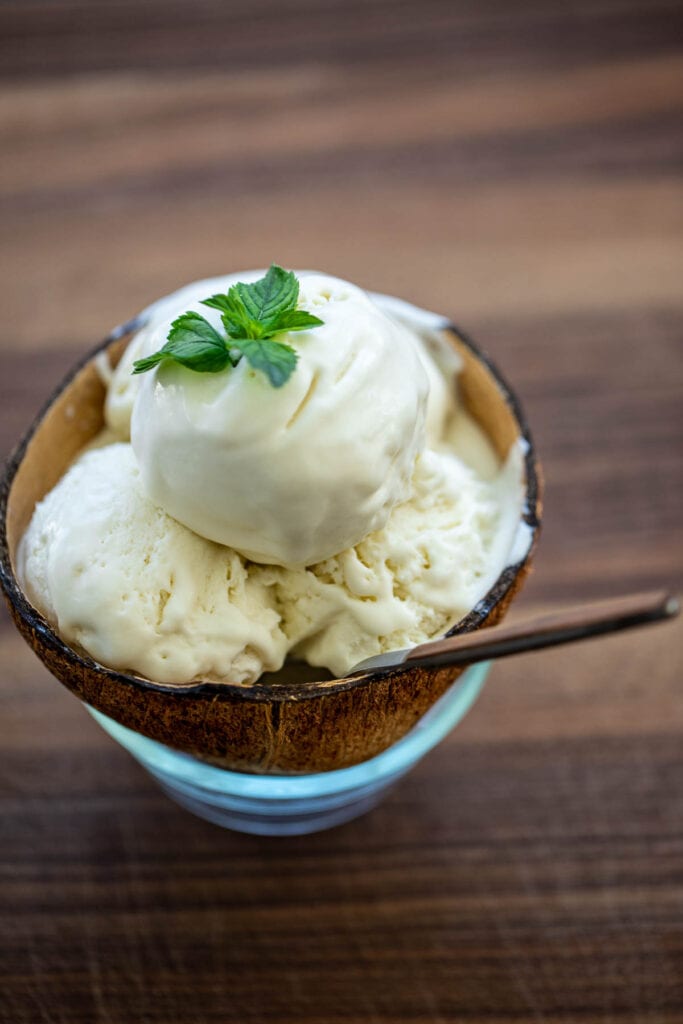 3 large scoops of coconut ice cream in a bowl