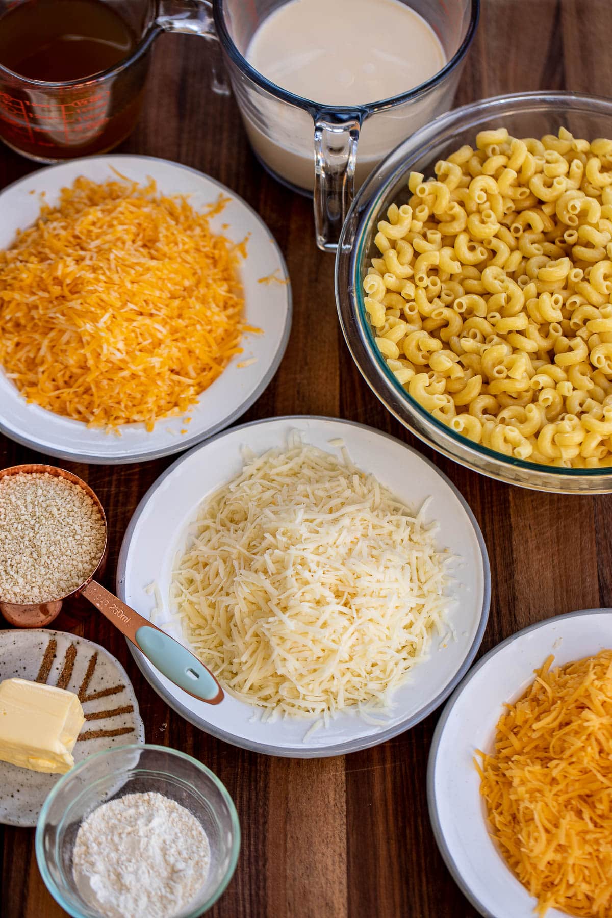 Ingredients for 3 cheese mac and cheese on a chopping board